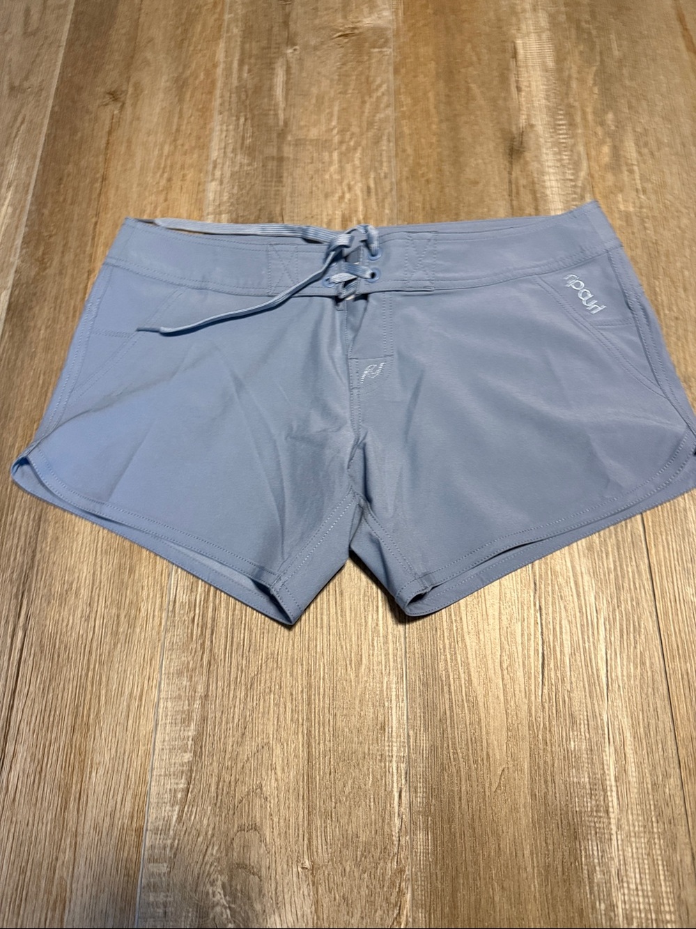 Rip Curl board shorts feature a lace-up drawstring